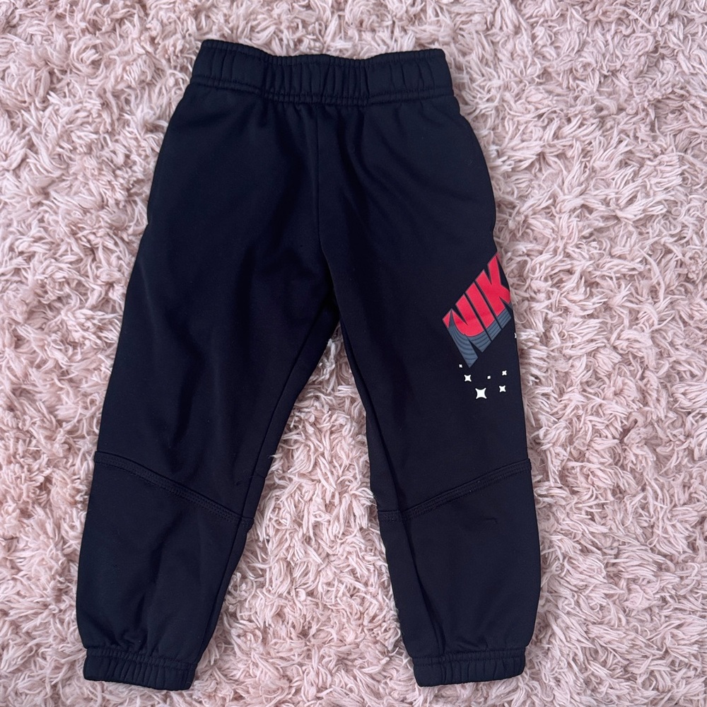 Nike Kids Black Joggers with Red Logo